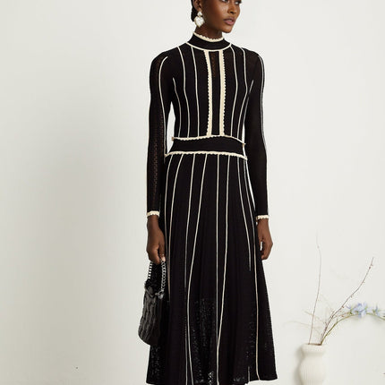 Raffaelina Black and White Maxi Dress with Vertical Stripes and Ruffled Detailing