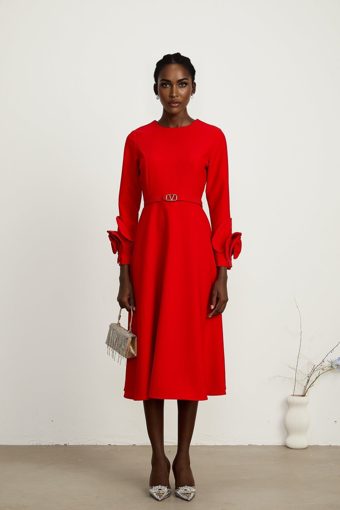 Red long sleeve dress with floral decorations by Aurelia
