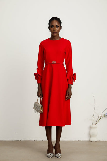 Red long sleeve dress with floral decorations by Aurelia