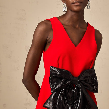 Red mini dress with vneck and sequin bow detail