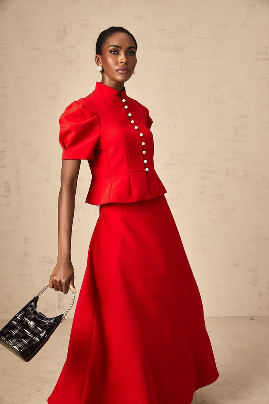 Red pleated blouse and skirt matching set named Colette featuring a coordinated top and bottom in a vibrant red color with pleated details