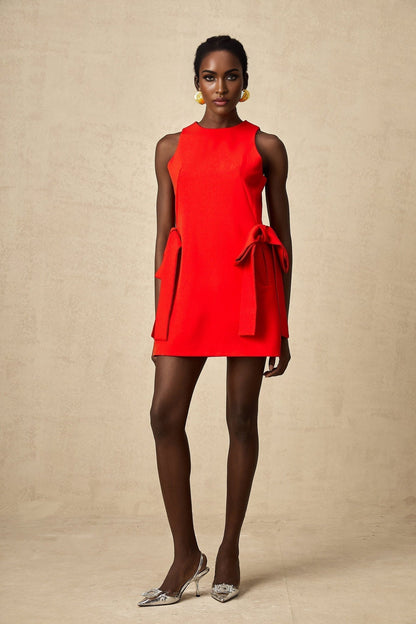 Red sleeveless mini dress with bow detail named Ronnie