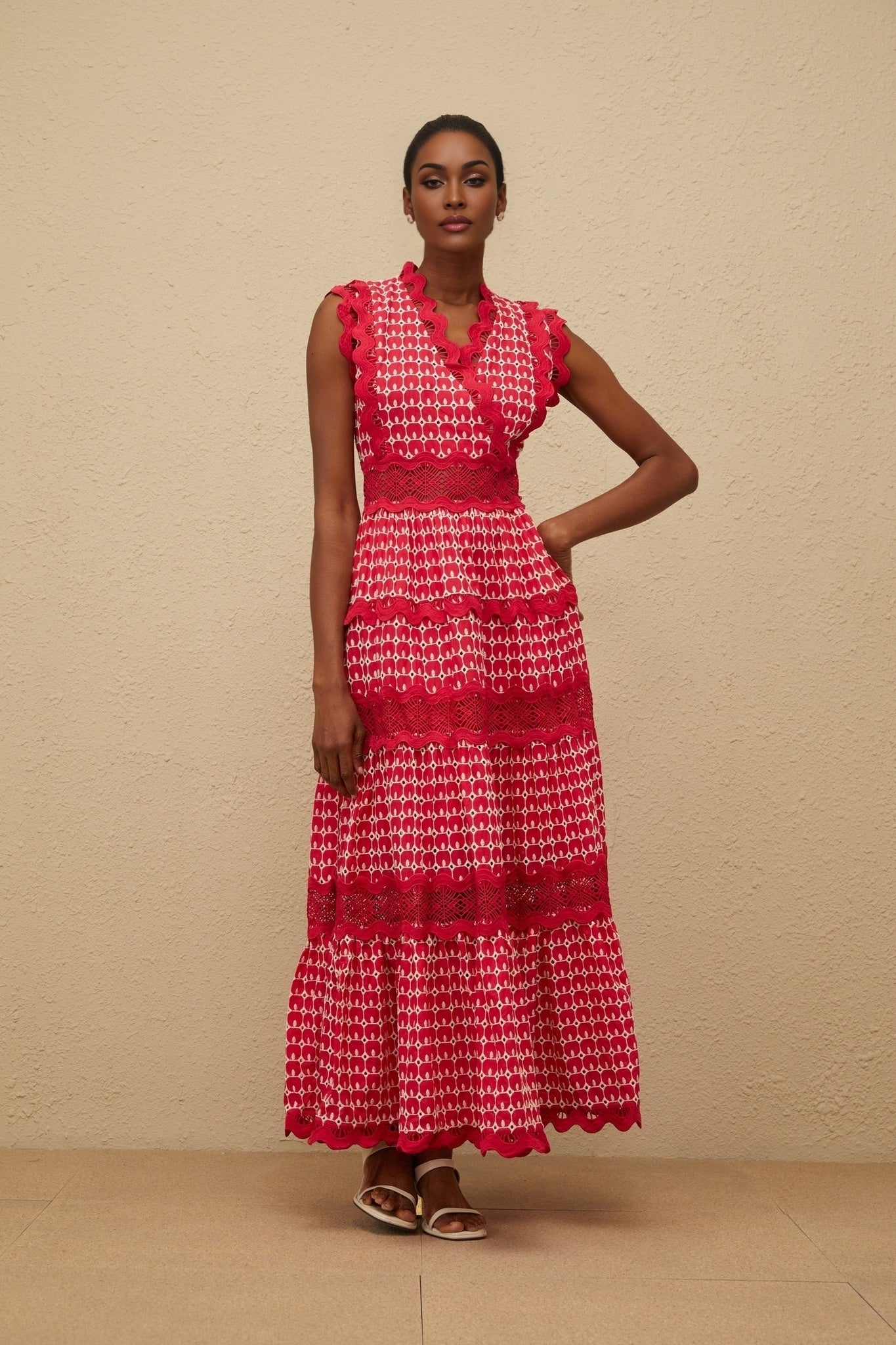 Red sleeveless V-neck maxi dress with lace panelling and cut-out design