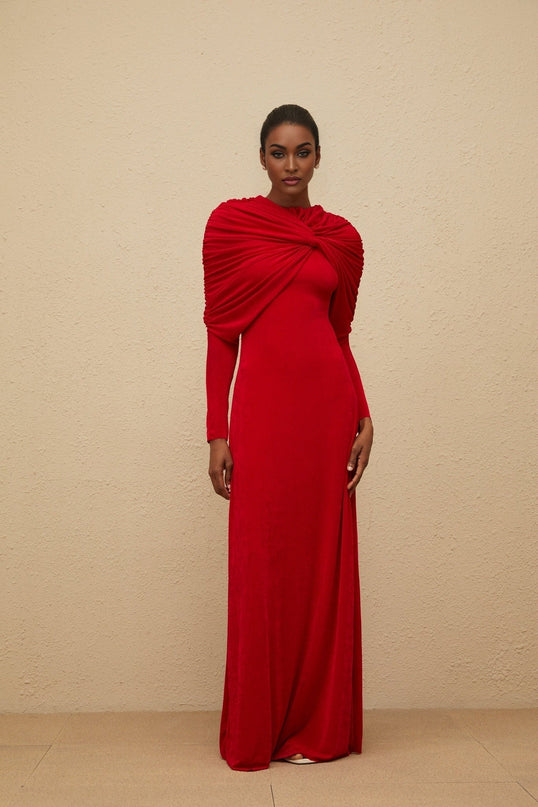 Red stretch cape design maxi dress with ruched detailing and rear zip fastening