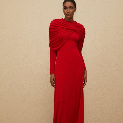 Red stretch cape maxi dress with ruched detailing and rear zip fastening