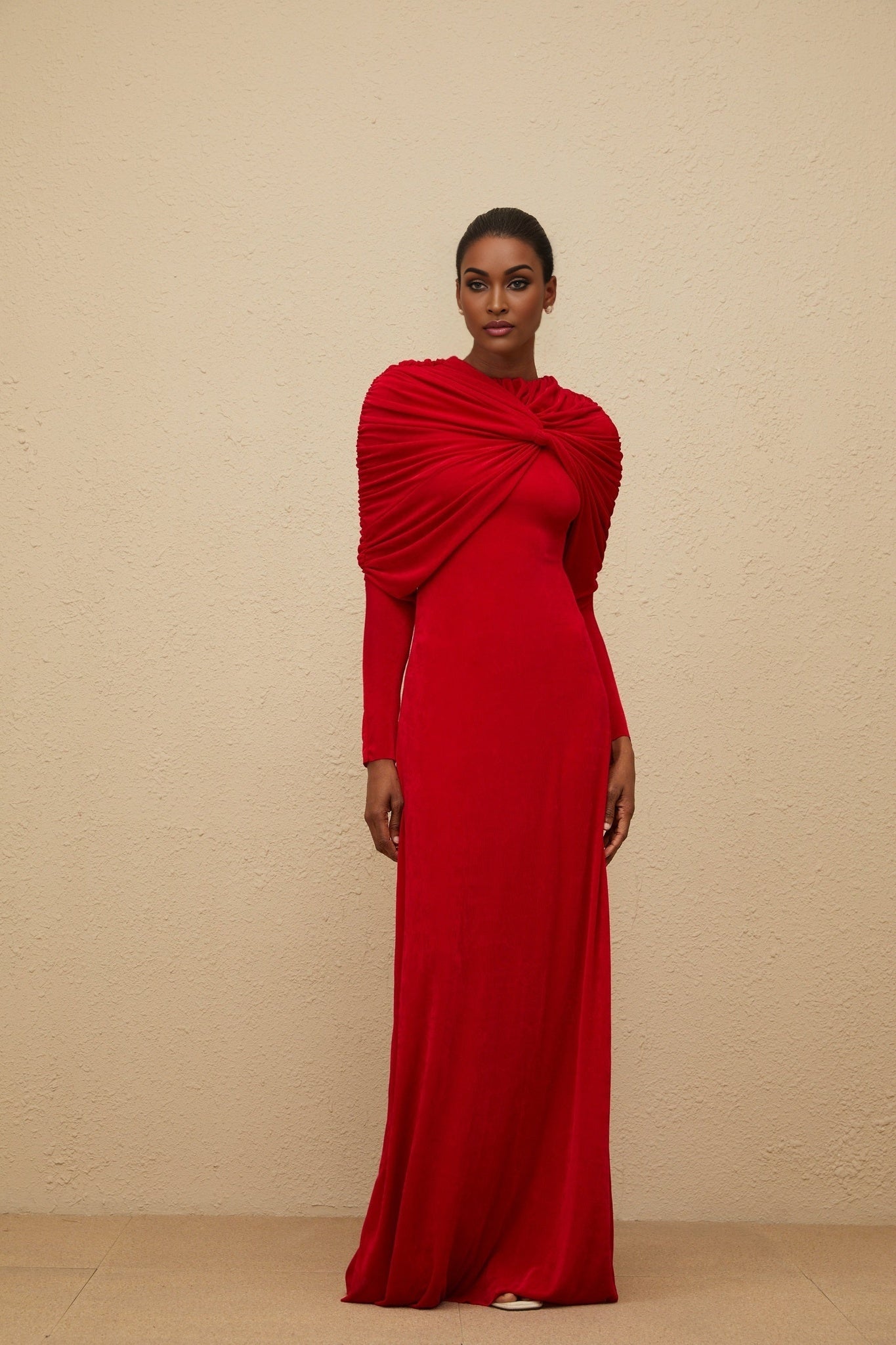 Red stretch cape maxi dress with ruched detailing and rear zip fastening