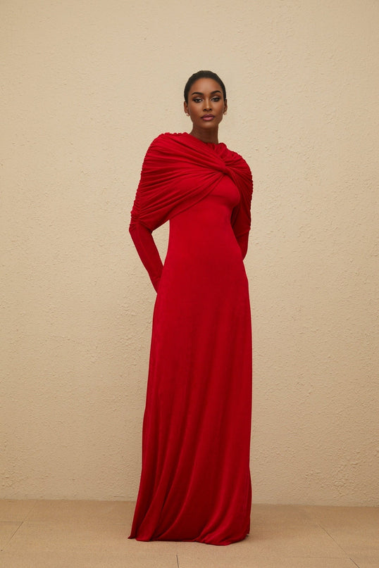 Red stretch cape maxi dress with ruched detailing and rear zip fastening