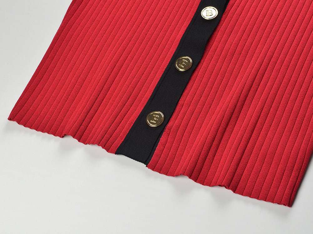 Red V-neck button-down with black accents and gold buttons