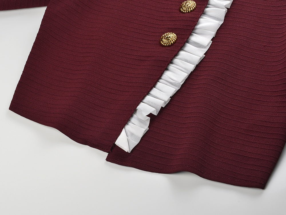 Red vintage-inspired cropped tailored blouse with ruffled front detail and gold button accents