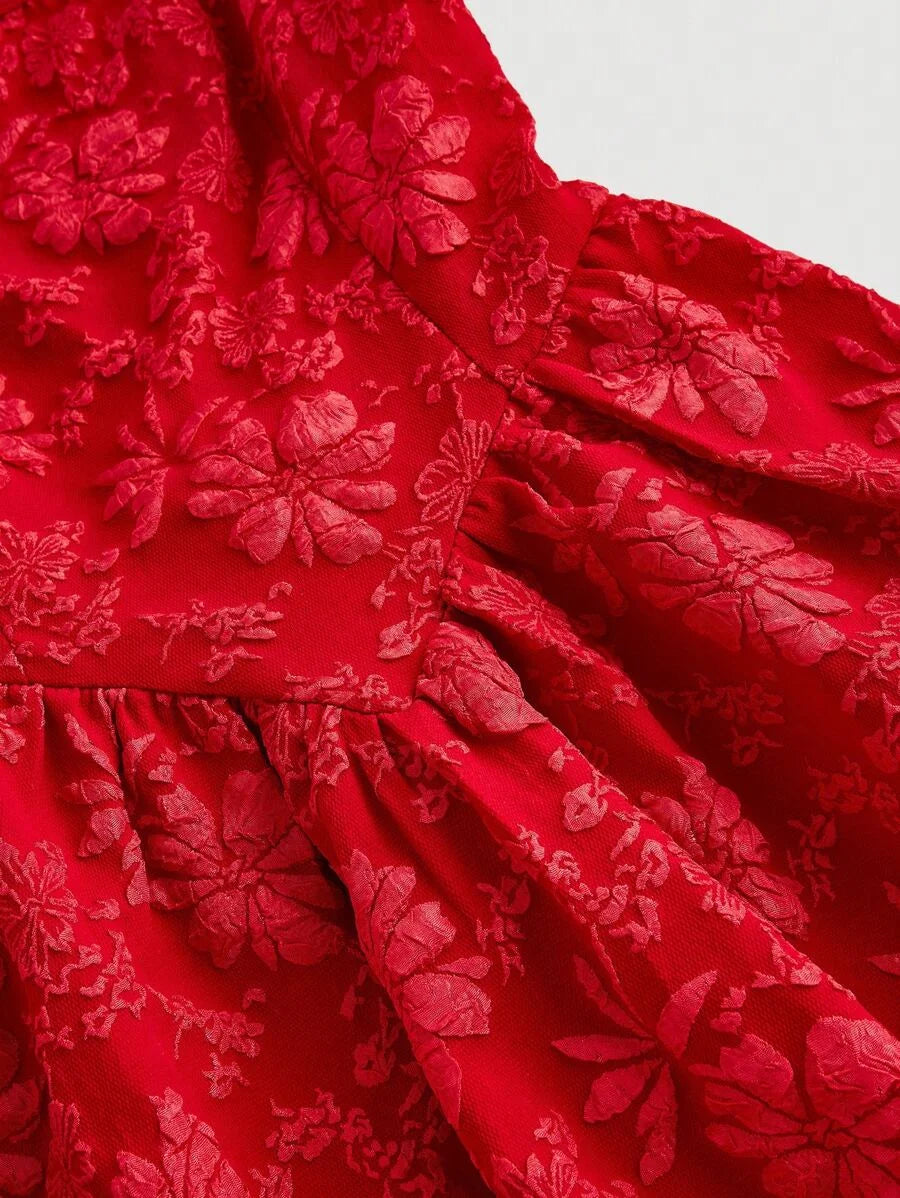 Elegant red jacquard mini dress with a structured bodice, square neckline, and flared skirt, featuring intricate floral patterns for a sophisticated look