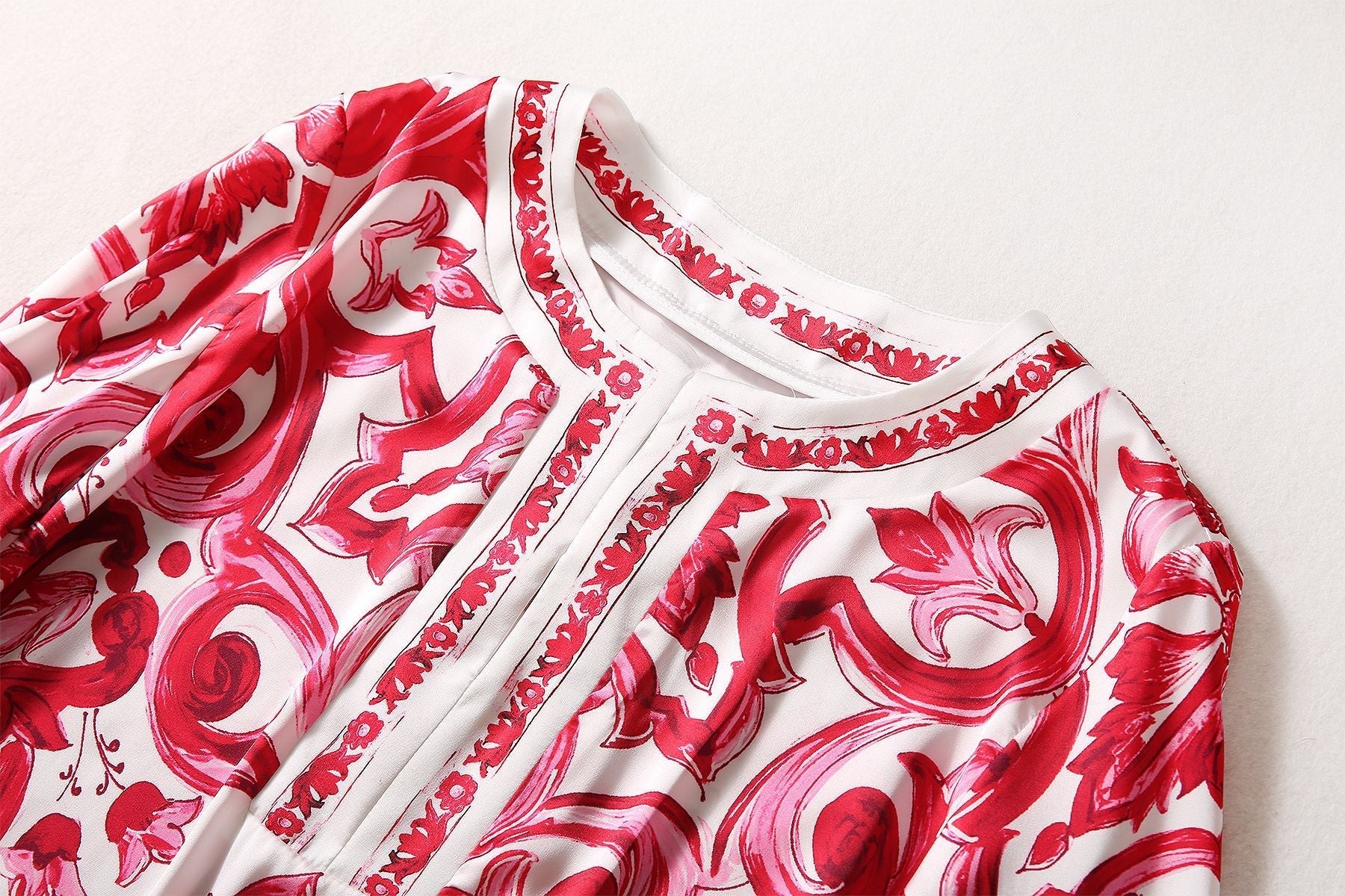 Red and white boho-chic maxi dress with baroque-inspired print and bell sleeves