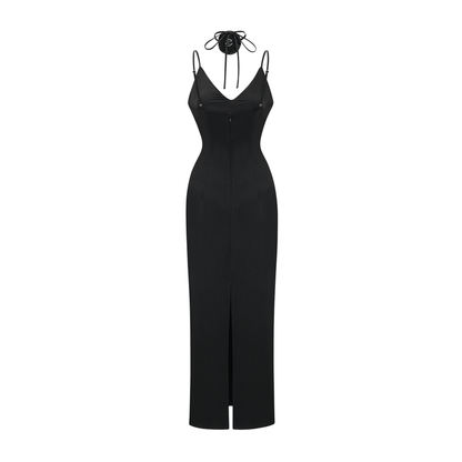 Black anklelength dress with spaghetti straps flower decoration at the neck open back and made of 100% polyester