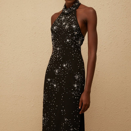 Rhea Maxi Dress in Black halterneck sleeveless fitted waistline metallic threading crystal embellishments side slit straight hem rear button zip fastenings elegant special occasions 65% Cotton 35% Terylene fiber