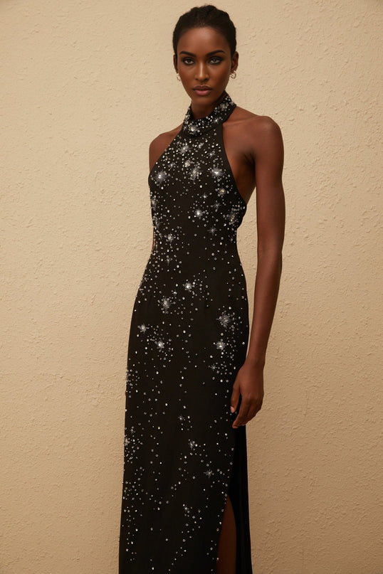 Rhea Maxi Dress in Black halterneck sleeveless fitted waistline metallic threading crystal embellishments side slit straight hem rear button zip fastenings elegant special occasions 65% Cotton 35% Terylene fiber