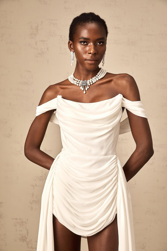 Riccarda White Off-Shoulder Ruched Mini Dress Ribbon Design Layered Silhouette Cowl Neck Panelled Construction Curved Hem Rear Zip Fastening Internal Shorts Thigh-Length Cut Terylene Fiber Modern Luxury Elegance