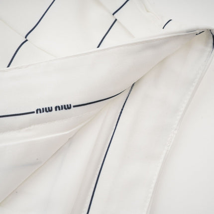 Rinata White Sleeveless Top and Pleated Skirt Matching Set
