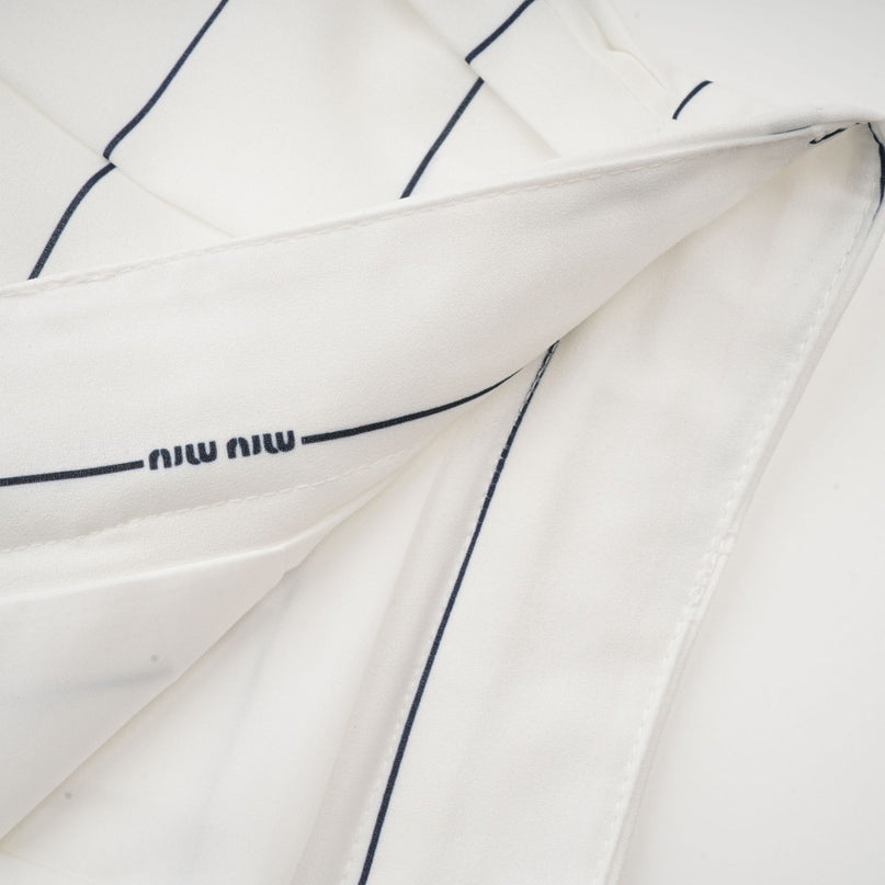 Rinata White Sleeveless Top and Pleated Skirt Matching Set
