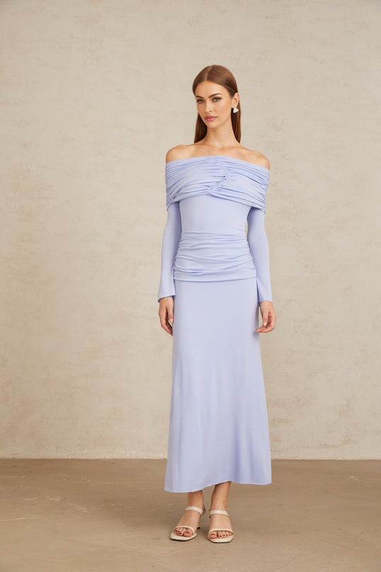 Rosanna Maxi Dress in Light Blue Off-Shoulder Silhouette Flared Sleeves Ruched Detailing Fitted Waistline Stretch Design 100% Terylene Fiber Rear Zip Fastening Maxi Length