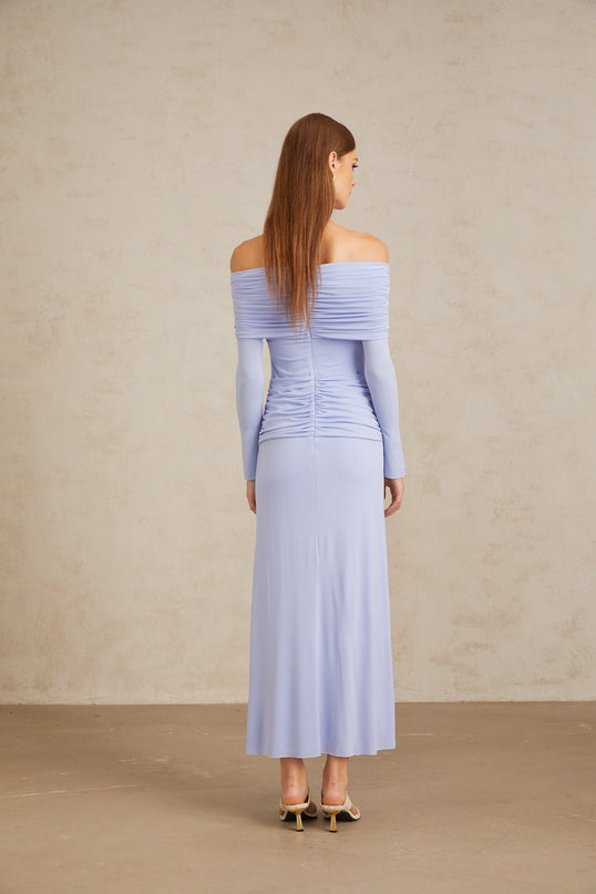 Rosanna Maxi Dress in Light Blue Off-Shoulder Silhouette Flared Sleeves Ruched Detailing Fitted Waistline Stretch Design 100% Terylene Fiber Rear Zip Fastening Maxi Length Special Occasions Elegant Evenings Out Statement Piece Style Grace