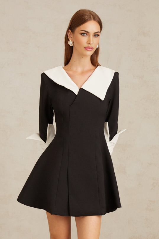 Rowan Black Color Block Mini Dress V-Neckline Asymmetrical Lapels Cinched Waist Flare Skirt Front Slit Long Sleeves Rear Zip Fastening Thigh Length