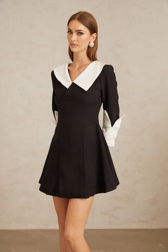 Rowan Black Color Block Mini Dress V-neckline Asymmetrical Lapels Cinched Waist Flare Skirt Front Slit Long Sleeves Rear Zip Fastening Thigh Length