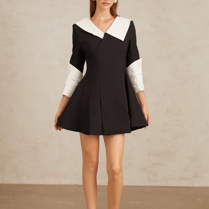 Rowan Black Color Block Mini Dress V-Neckline Asymmetrical Lapels Cinched Waist Flare Skirt Front Slit Long Sleeves Rear Zip Fastening Thigh Length