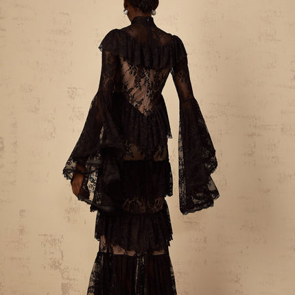 Roxane black maxi dress with floral lace pattern and ruffled details full length view on white background