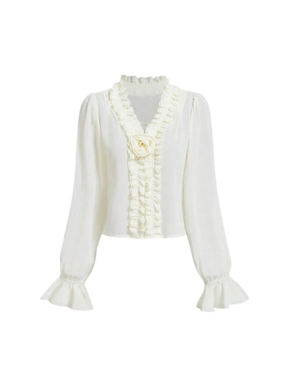 White chiffon blouse with ruffled details and flared sleeves