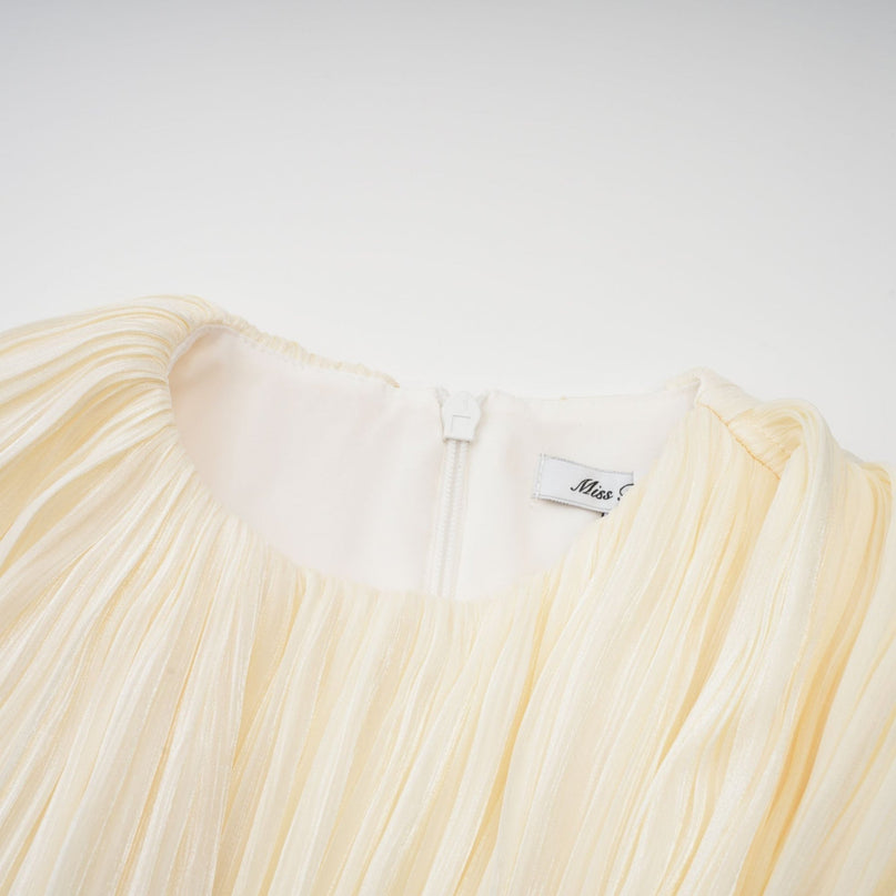 Sara Neutrals Mini Dress with Pleated Fabric, Ribbon Detailing, and Glitter Accents