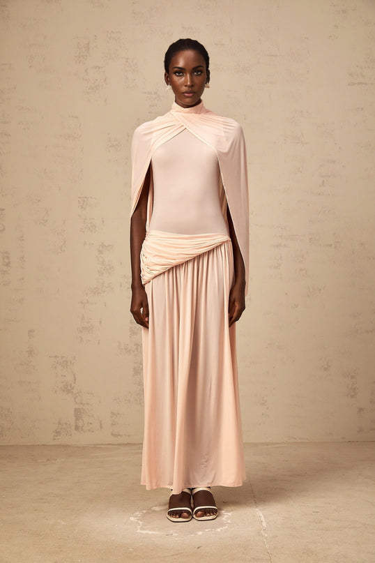 Sarai Maxi Dress in Shrimp Pink Sleeveless Cape Design Pleated Skirt Asymmetrical Silhouette