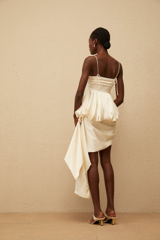 Savina Mini Dress in Neutrals square neck sleeveless spaghetti straps peplum waist asymmetrical scarf design lustrous satin finish side zip fastening 95% Terylene fiber 5% Spandex luxury comfort fashion connoisseur