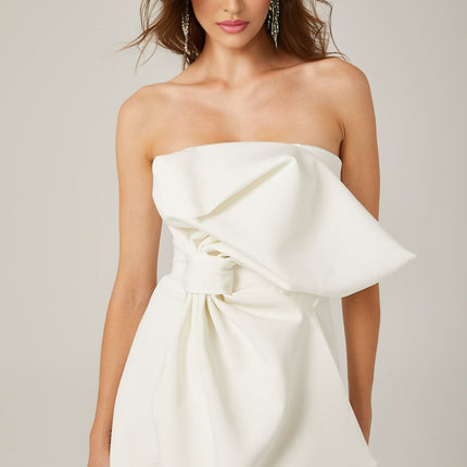 Shayla White Mini Dress with Oversize Bow Off-Shoulder Design 97% Polyester 3% Spandex Rear Zip Fastening Thigh-Length Asymmetric Silhouette Fashion-Forward Luxurious Feel