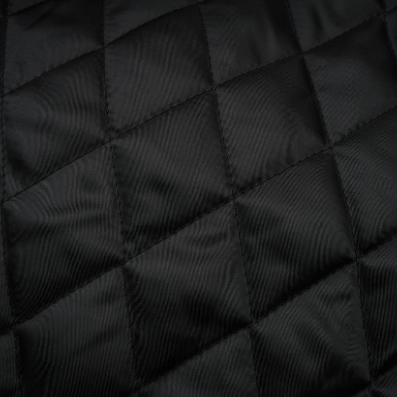 Short quilted leather jacket in brown color with zipper closure and stand collar