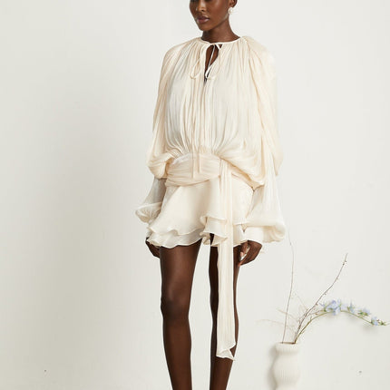 Sienna Mini Dress Neutrals Elegant Sophisticated Luxurious Twist Design Ruffled Hem Glitter Detailing Semi-Sheer Pleating Neck Tie Fastening Shoulder Pads Dramatic Draped Silhouette Rear Button Side Zip Fastening Versatile Statement Piece