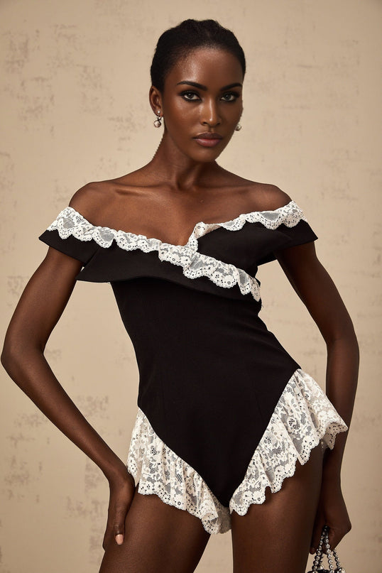 Sleek black bodysuit with delicate lace trim along edges