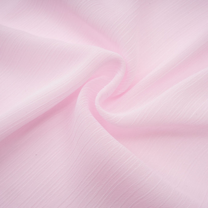 Sleeveless light pink semi sheer top with straight neckline