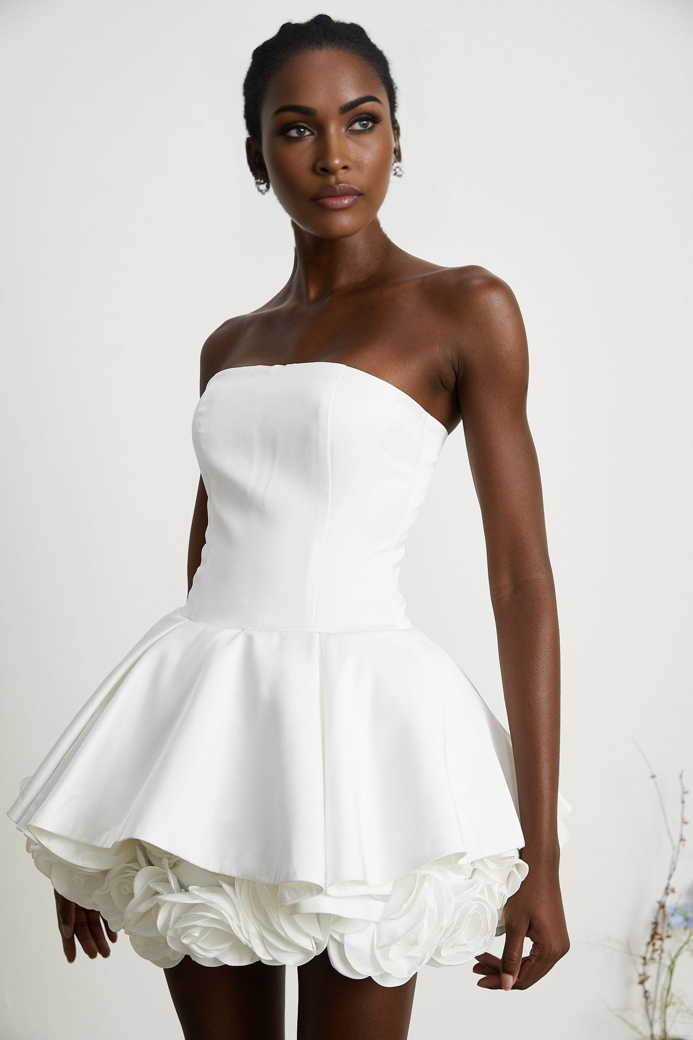 Sleeveless white corset mini dress with floral petal details named Lucie