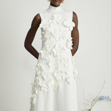 Sleeveless white maxi dress with bow and artificial flower embellishment named Magali