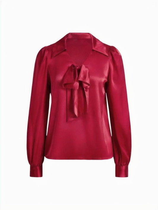 Isabelle satin bow blouse with a silky finish, long sleeves, and an elegant bow detail in red