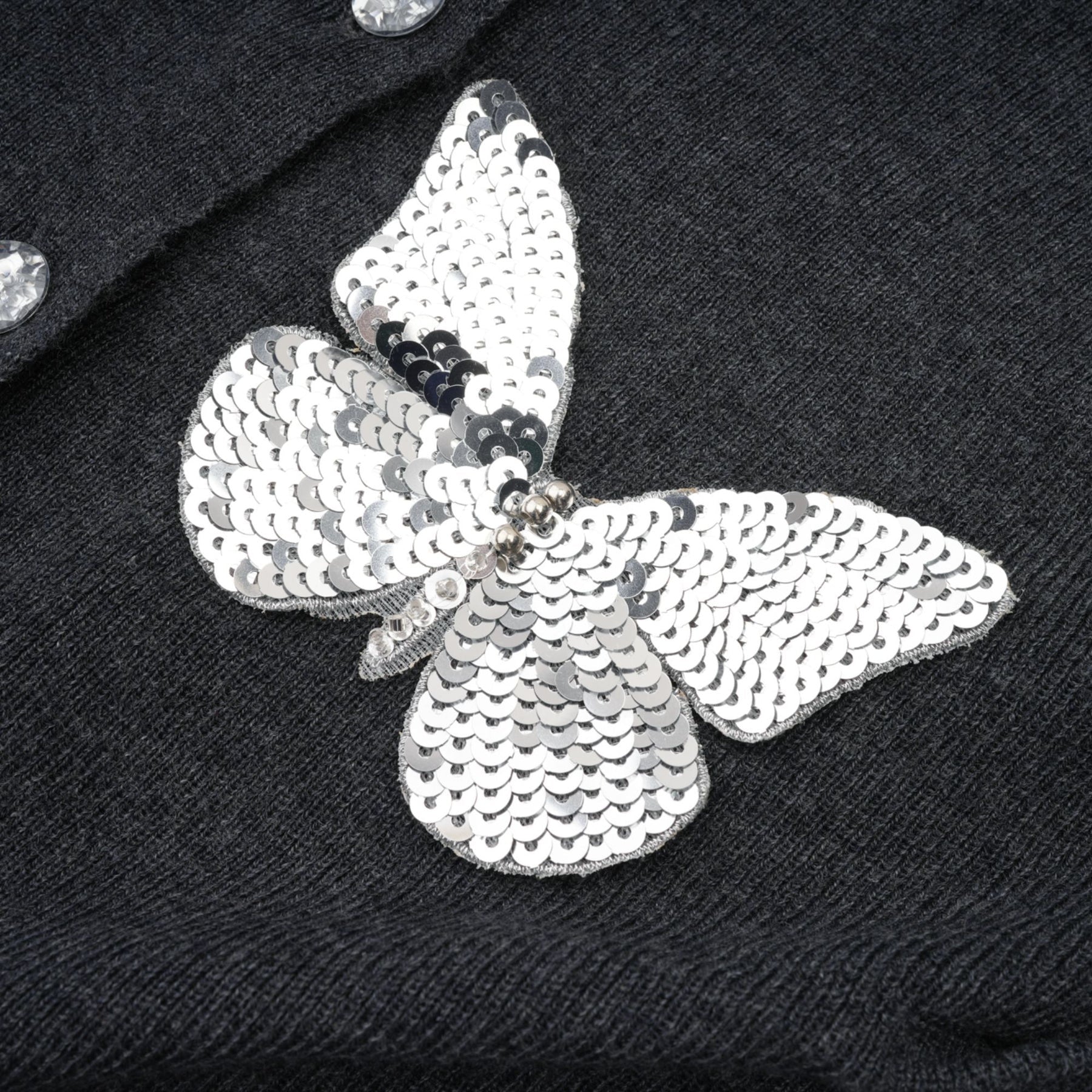 Sparkling grey cardigan with butterfly design featuring sequin embellishments