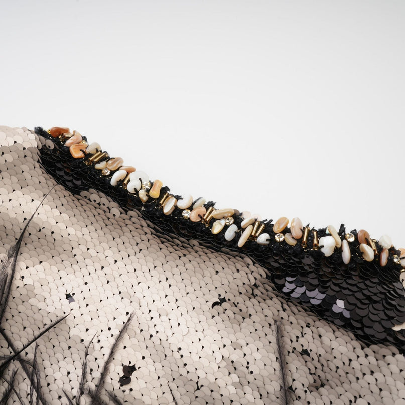 Sparkling short jacket adorned with sequins and feather embellishments