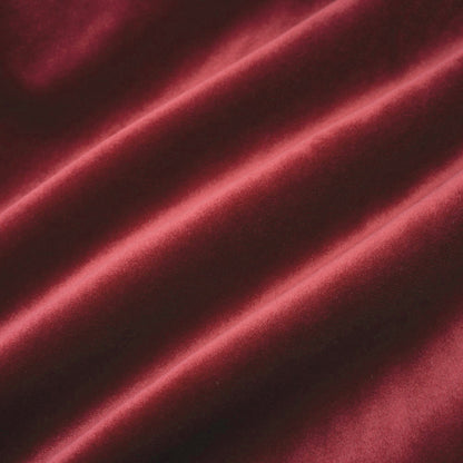 Strapless mini dress Wivika made of velvet and faux fur featuring a dark colored velvet bodice and a light colored faux fur skirt