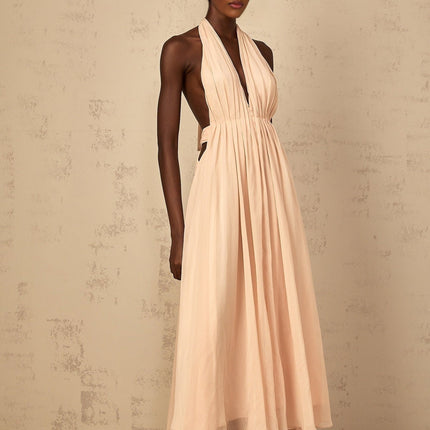 Teresa Maxi Dress in Peach Pink Neutrals halter-neck shirred tulle open back design cinched waist 100% Terylene fiber rear tie zip fastening special occasions