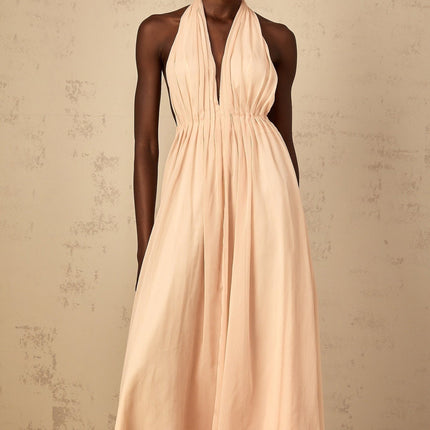 Teresa Maxi Dress in Peach Pink and Neutrals halter-neck silhouette shirred tulle fabric open back design modern elegance maxi length cinched waist 100% Terylene fiber intricate detailing rear tie zip fastening special occasions statement