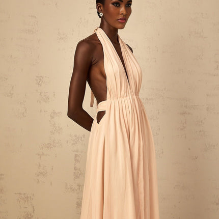 Teresa Maxi Dress in Peach Pink and Neutrals halter-neck silhouette shirred tulle open back design cinched waist 100% Terylene fiber rear tie zip fastening special occasions