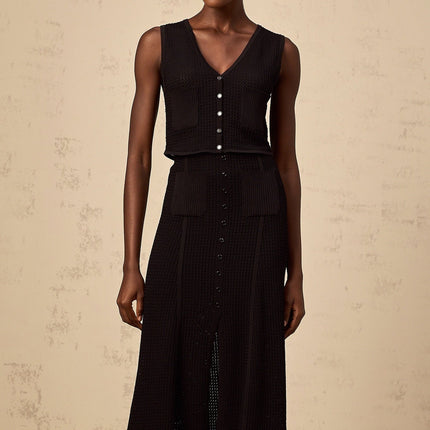 Teresa Black Top Skirt Set Pointelle Knit V Neck Sleeveless Front Patch Pockets Ribbed Hem Buttons Elasticated Waistband Front Slit Decorative Buttons Luxury Modern Silhouette Viscose Nylon Half Lining Calf Length