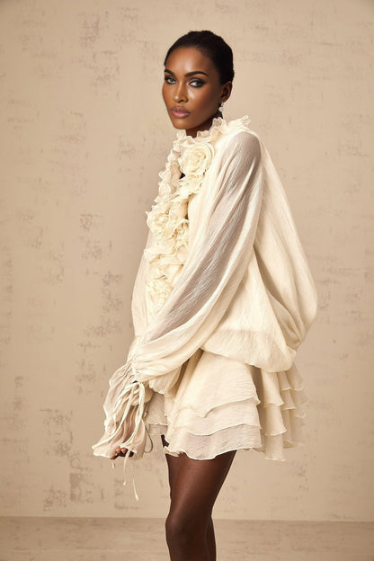 Tiered mini dress in neutral tones with floral applique details named Zephyrine