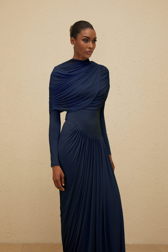Tinsley Maxi Dress in Blue Navy Long Sleeve Mesh Shawl Pleated Detailing Asymmetrical Design Floor Length Luxury Style
