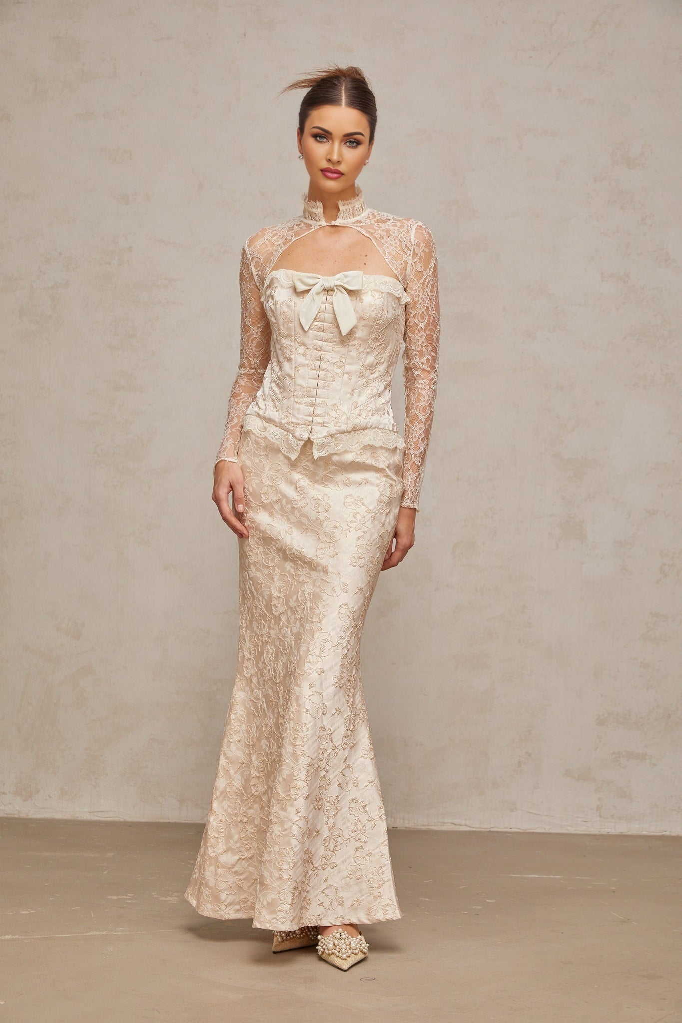 Two piece ivory outfit with patterned jacquard fabric top and matching skirt