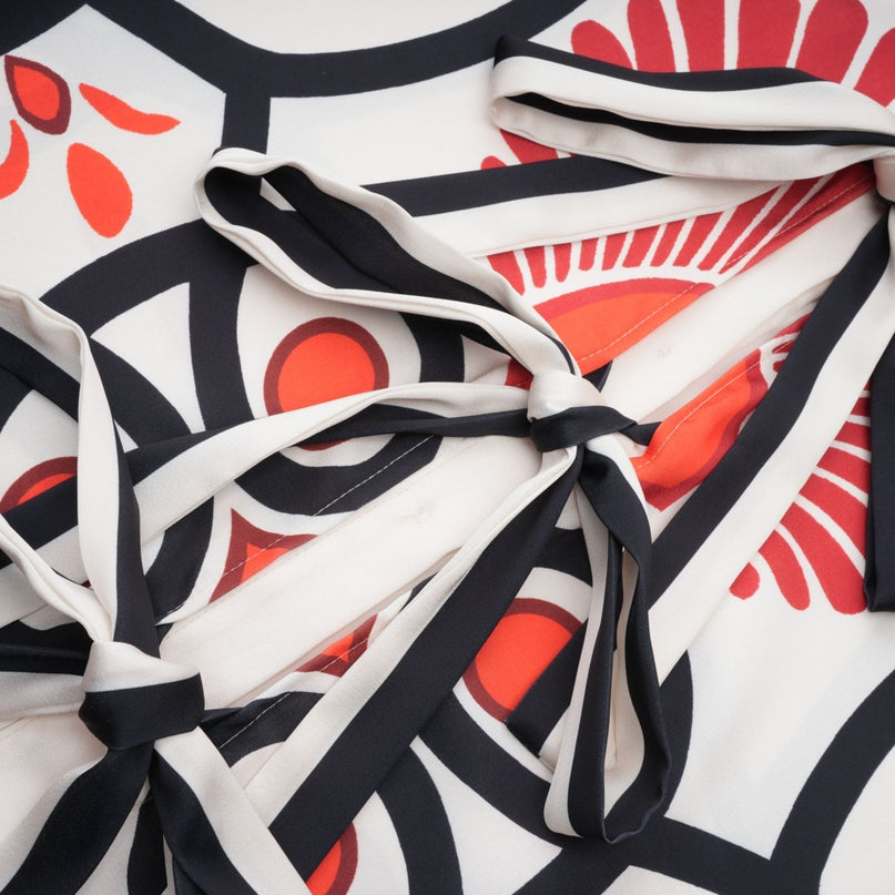 Two piece matching set featuring a graphic print shirt and trousers in Amaranta design